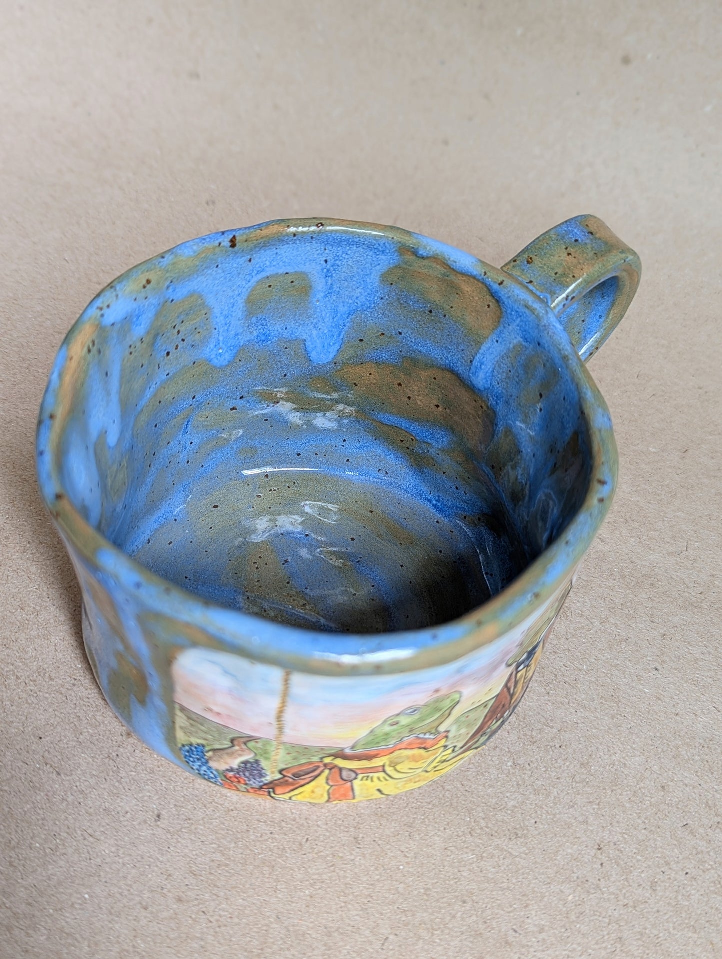 Handmade ceramic mug with frogs in love